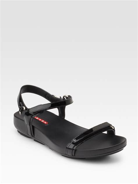 prada flat sandals black.